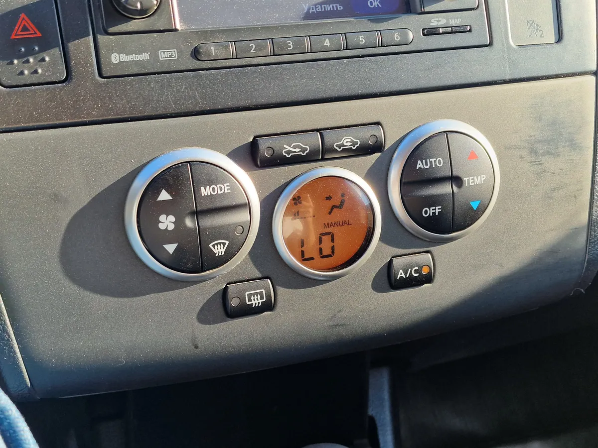 Nissan Tiida 1.6 AT (110 л.с.)