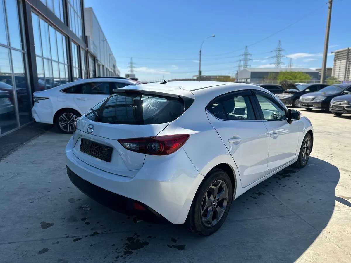 Mazda 3 1.6 AT (104 л.с.)