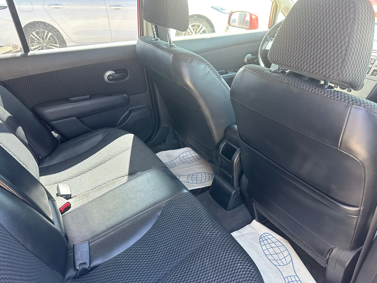 Nissan Tiida 1.6 AT (110 л.с.)