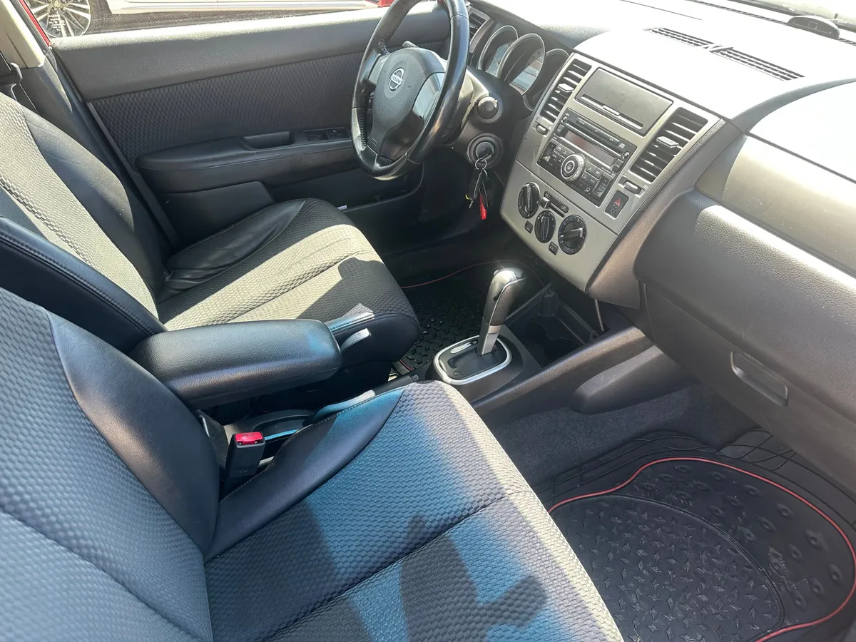 Nissan Tiida 1.6 AT (110 л.с.)