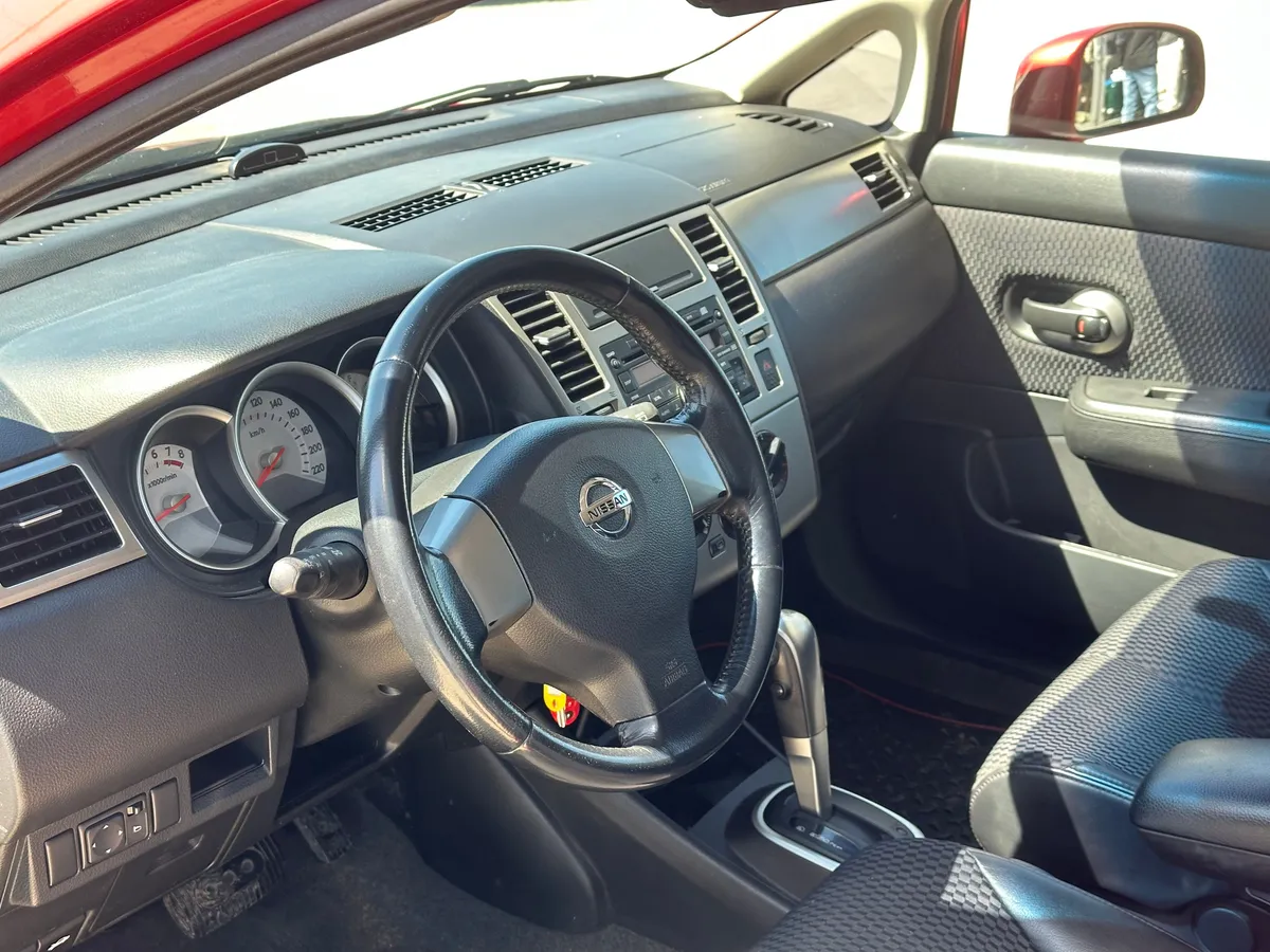 Nissan Tiida 1.6 AT (110 л.с.)